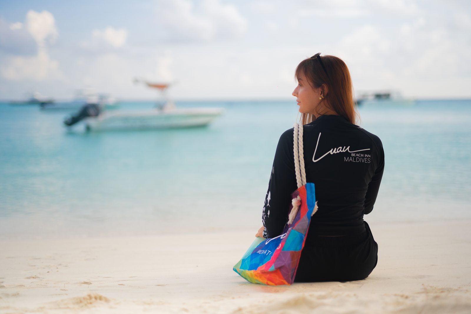 Branded rashguard on the beach