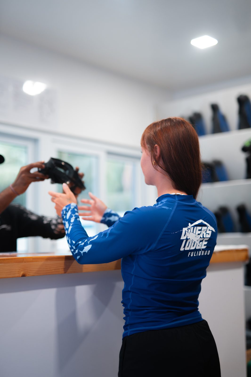 Divers Lodge Fulidhoo logo on rashguard
